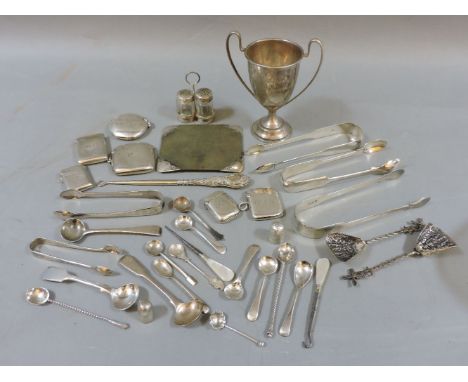 A parcel of silver items, including vesta cases, sugar tongs, and button hooks