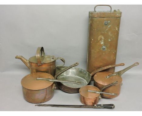 Three Victorian copper saucepans and lids, a frying pan, a hot water can, and a vintage car foot warmer