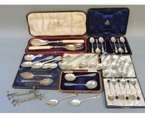 Silver flatware, comprising salad servers, coffee and teaspoons, two pairs of spoons, and a quantity of loose silver tea and 
