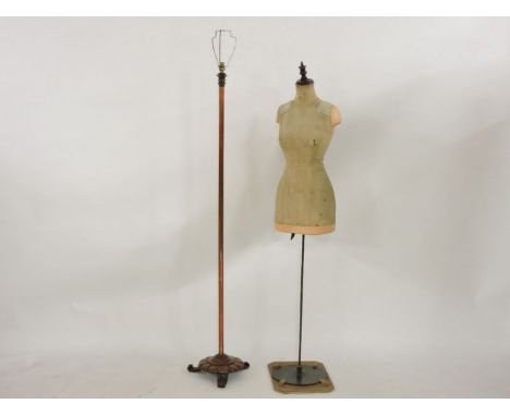 A standard lamp, and a shop mannequin