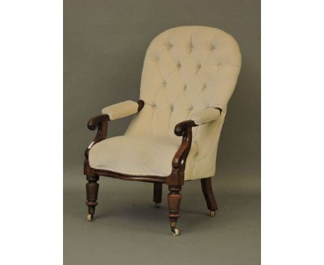 A Victorian mahogany button back armchair