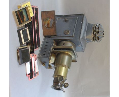A magic lantern, tin and brass with some slides
