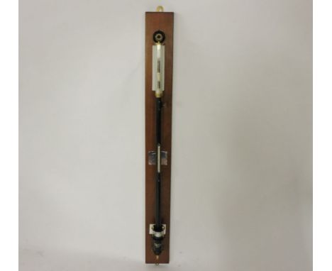 A 'Marine' stick barometer, of cylindrical form, no 2911, on a mahogany board, barometer 102cm high