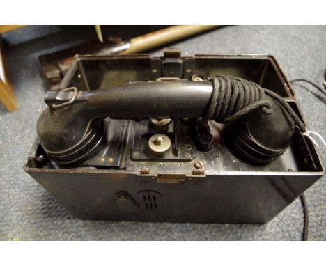 A World War II German army field telephone,&nbsp;with headset, dated 1941. 