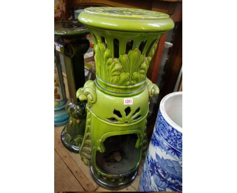 An unusual&nbsp;Bretby green glazed pottery pedestal heater and cover, 86.5cm high, (restored chip). 