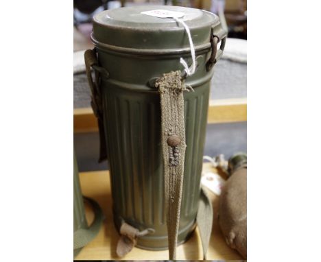 A World War II German Army gas mask,&nbsp;in tin dated 1939. 