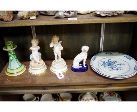 Two similar Meissen porcelain figures of cherubs,&nbsp;largest 18.5cm high, (chips); together with a Victorian Staffordshire 