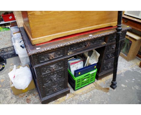 A late Victorian carved oak pedestal desk, 122cm wide.&nbsp; 
