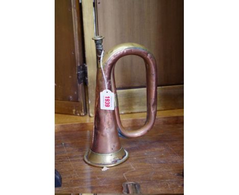 An old copper and brass bugle,&nbsp;inscribed 'Jerome Thibouville-Lamy &amp; Co'. 