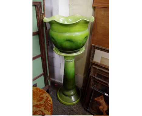 A Bretby green glazed jardiniere and pedestal,&nbsp;92cm high.&nbsp; 