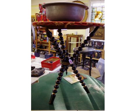 A Victorian ebonized and parcel gilt tripod gypsy table,&nbsp;with velvet top and bobbin turned supports, 55cm diameter. 