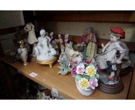 A mixed lot of Capodimonte figures and similar, (two shelves). 