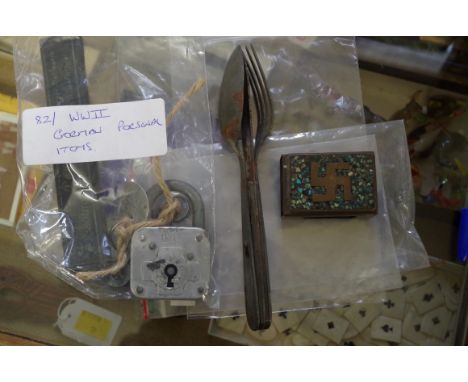 A collection of World War II German personal items,&nbsp;to include a knife, fork and spoon set; a cut throat razor; padlock;