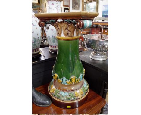 A Doulton Lambeth majolica jardiniere and pedestal, total height 95cm high, (chips). 