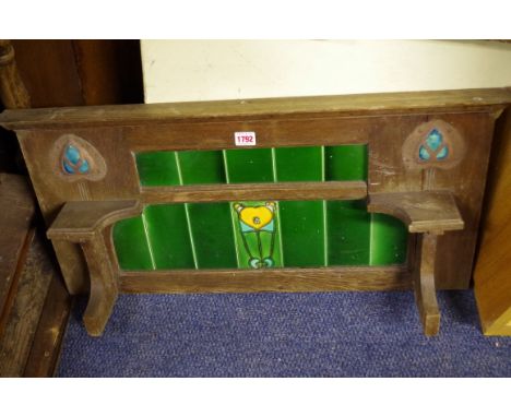 A circa 1900 oak&nbsp; and tile splashback,&nbsp;the tiles probably by Minton and incorporating Ruskin style mounts, 78cm wid
