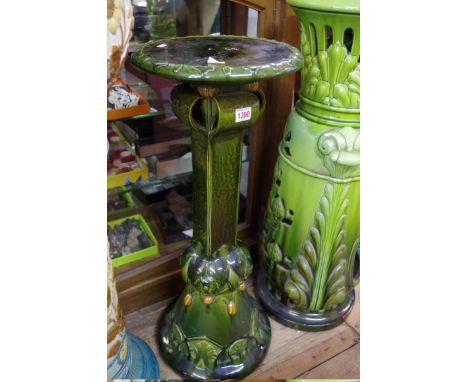 An Arts and Crafts green glazed pottery pedestal, 77.5cm high. 