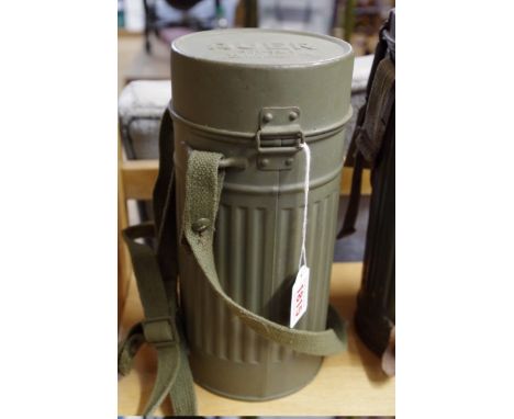 A World War II German Army gas mask, in tin dated 1938. 