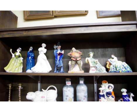 Seven Royal Doulton figures,&nbsp;comprising 'Solitude;, HN2810; 'Ascot', HN2356; 'Falstaff', HN2054; 'The Wizard', HN2877, (