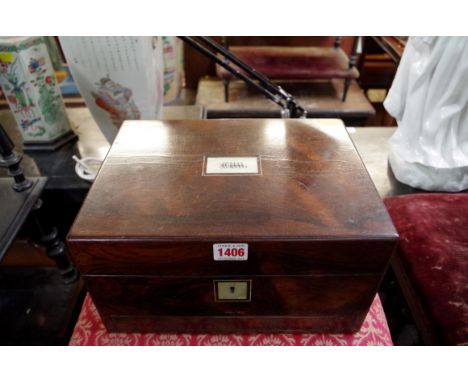 A Victorian rosewood and mother of pearl toilet box, with fitted interior, some items associated, 30.5cm wide.&nbsp; 