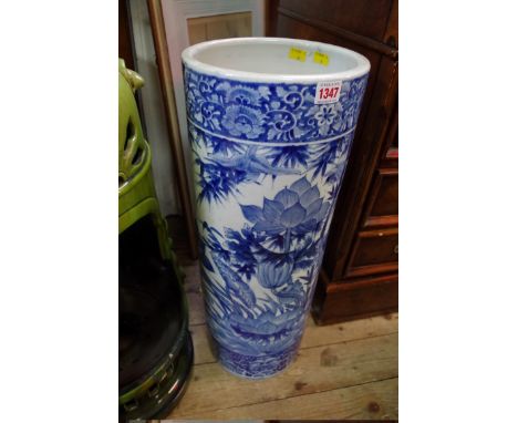 A Chinese blue and white cylindrical&nbsp;stick stand, painted with a continuous scene of birds and flowering branches, 63cm 