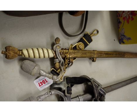 A World War II German Kriegsmarine dagger, with one hanger by Eickhorn. 