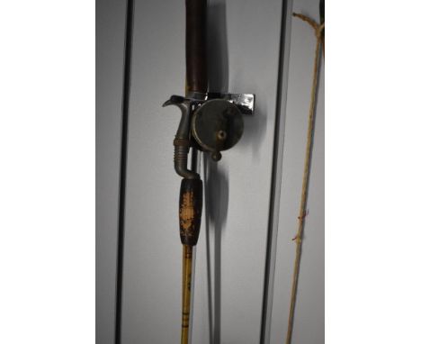 A vintage spinning reel by  A.B.URFABRIKEN SVANGSTA, RECORD 1300 made in sweden attached to a small 2 pc 5ft fiberglass pisto
