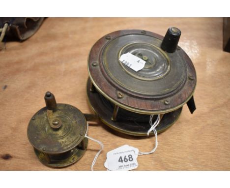 Two vintage fishing reels one brass and one made from brass and wood