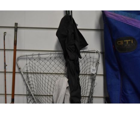 An Abu Garcia Conlon 300 8ft 2 pc rod and a Vintage 2pc Shore Caster rod both in soft sleeves along with two rod rests and la