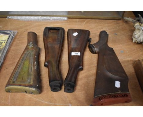Four vintage gun or rifel stocks