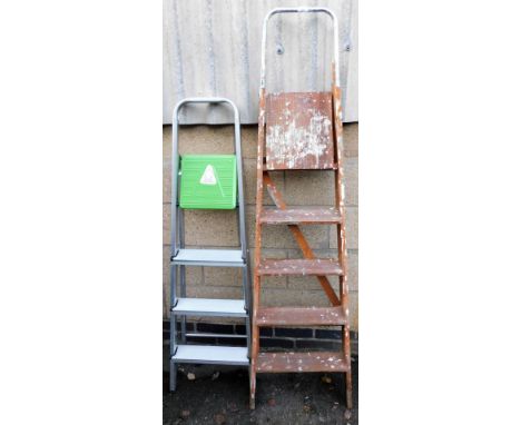 Two step ladders, comprising an aluminium four step ladder and a wooden five step ladder. (2)