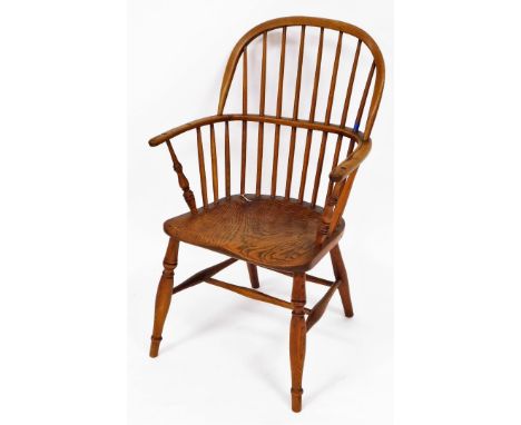 Taylor (Grantham). A 19thC low back Windsor chair, with plain spindles, C shaped arms, turned arm supports and ring turned fr