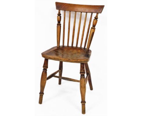 Wilson (Grantham). A 19thC ash and elm chair, with curved cresting rail turned spindles, shaped seat and ring turned front le