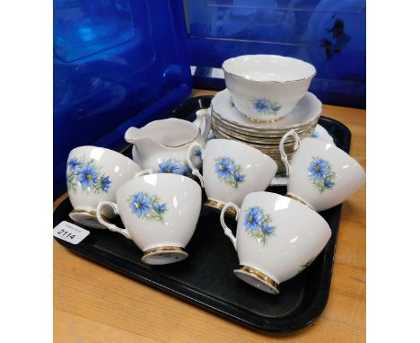 A Colclough china part tea service, decorated with blue flower pattern, to include cake plate, milk jug, sugar bowl, five cup