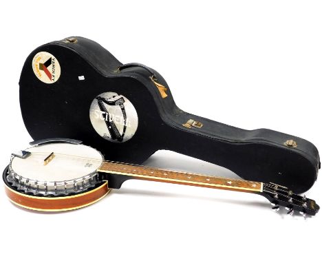A 20thC Remo Stagg banjo, six strings and chrome plated tuning pegs, 84cm wide, in fitted case.