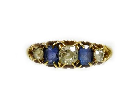 An 18ct gold sapphire and diamond five stone ring, set with three old cut diamonds and two rectangular cut sapphires, the lar