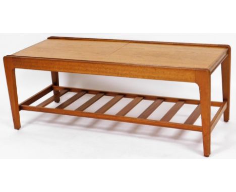 A Remploy teak coffee table, with sliding top enclosing tile top centre, 40cm high, 103cm wide when closed, 43cm deep.