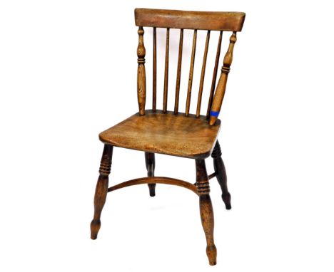 A 19thC ash and elm side chair, with fixed cresting rail, turned spindles, shaped seat, and triple ring turned legs joined a 