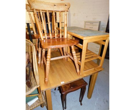 A group of furniture, to include an oak dining table, two pine kitchen chairs, a nest of two mahogany tables and two tile top