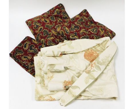 A pair of fruit and flower design drop curtains, and red Art Nouveau cushion covers and loose material. (a quantity)  N.B. Th