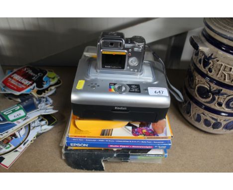A Kodak digital camera together with Kodak easy share printer and accessories