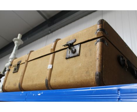 A wooden bound travelling trunk
