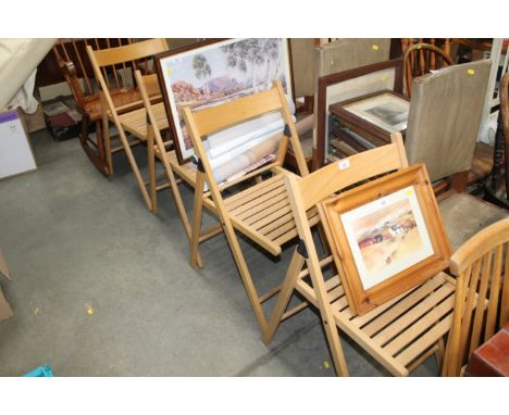 A light Ercol style stick back chair together with four folding chairs 