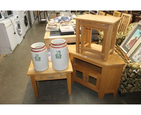 A light oak corner TV stand and an occasional table fitted single drawer and a graduated pair of occasional tables