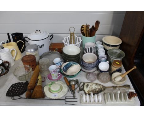 An enamel flour storage container; various vases; toast racks; wooden rolling pin etc