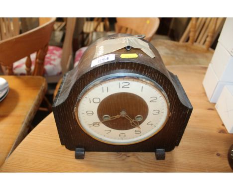 A two hole cased mantel clock 