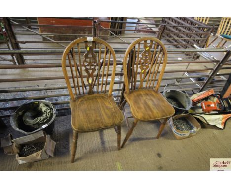 A pair of stick and wheelback chairs 