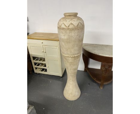 A tall ceramic lamp base