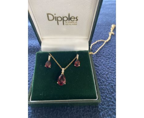 Yellow Gold Pear Cut Ruby &amp; Diamond Pendant with earrings
Boxed in original retail box from Dipples, Norwich.