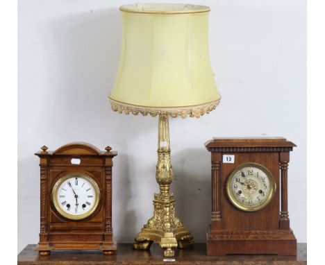 A gilt composition table lamp with shade; &amp; two early 20th century oak cased mantel clocks.