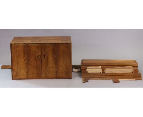 A mid-20th century Danish rosewood inter-changeable wall unit, comprising a double-door cupboard (80cm x 50cm x 40cm deep), f